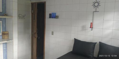 a corner of a room with a couch and a wall at Pousada Canto dos Passaros in Chapada dos Guimarães