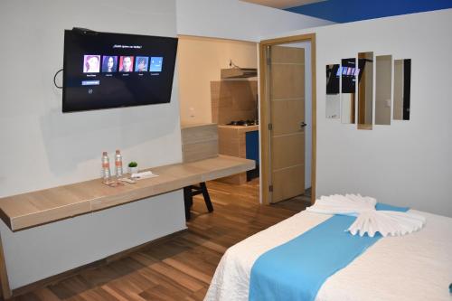 Ένα ή περισσότερα κρεβάτια σε δωμάτιο στο Hotel Boutique Casa Mariano