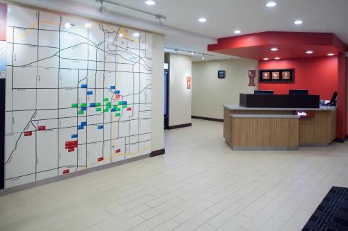 a lobby with a large wall with a map on it at TownePlace Suites by MarriottDetroit Canton in Canton