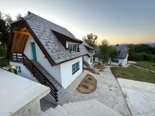 an image of a house with a roof at Retro Village Ravne in Visoko