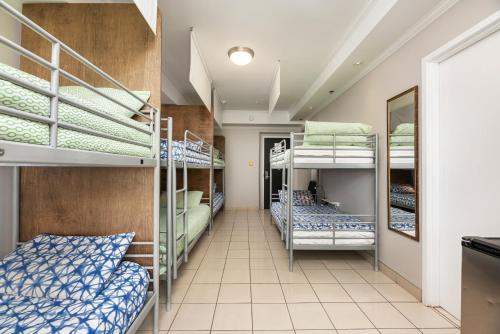 a hallway with bunk beds in a dorm room at Samesun Montreal Hotel & Hostel in Montréal
