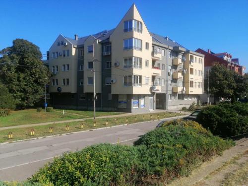 an apartment building on the side of a street at River Lux in Sremska Mitrovica