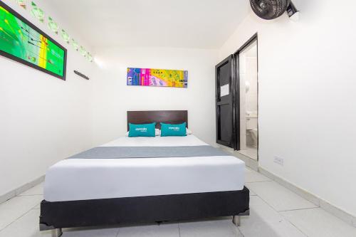 Ein Bett oder Betten in einem Zimmer der Unterkunft Hotel Villas de San Juan