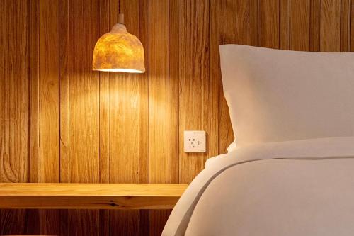 Ένα ή περισσότερα κρεβάτια σε δωμάτιο στο Hantang Inn Hostel Xi'an