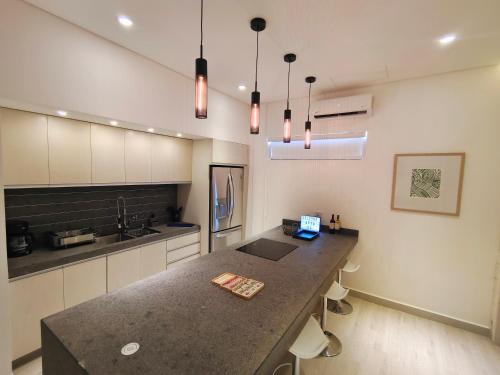 a kitchen with a counter with a laptop on it at 1st Luxury Warehouse in Cancún