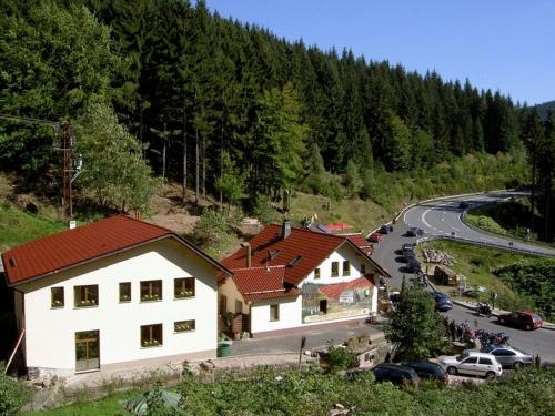 a group of houses on a hill next to a road at Hotel & Gasthaus Sterngrund in Zella-Mehlis