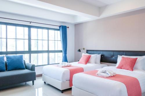 Postel nebo postele na pokoji v ubytování CenterParcs by Paxton Chiangmai (清迈柏栎子居酒店)
