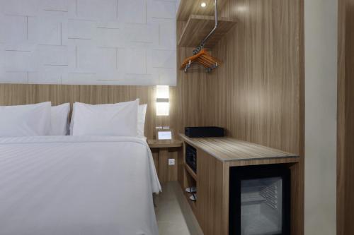 a hotel room with a bed and a desk at Aston Nagoya City Hotel in Nagoya