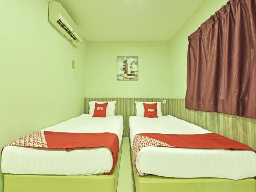 صورة لـ Super OYO Capital O 90545 Ho Hotel في ميلاكا