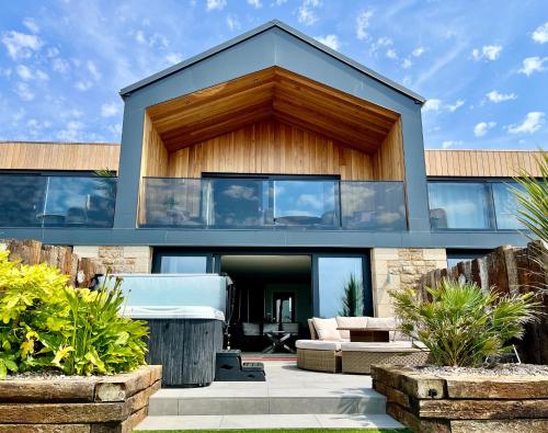 a house with a lot of windows at Sea Scape in Penzance