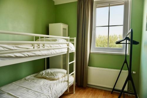 Krevet ili kreveti na kat u jedinici u objektu Vakantiewoningen Zandbooi