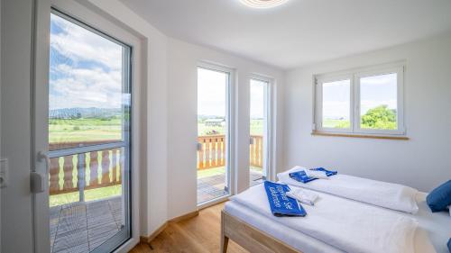 Posteľ alebo postele v izbe v ubytovaní Apartments Presslauer - Mori