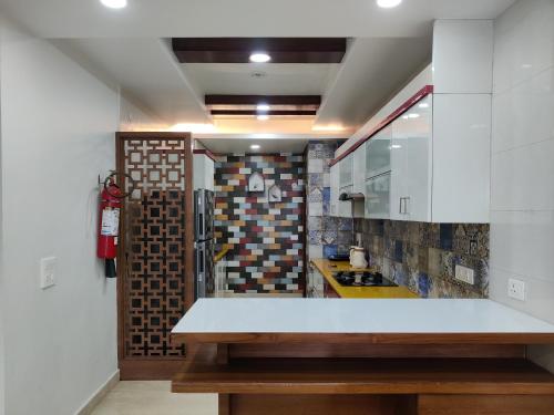 a kitchen with a white counter top in a room at MOON3BHK By Wabi Sabi Stays in Mussoorie