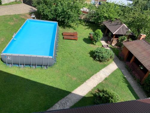 an overhead view of a swimming pool in a yard at Затишок в Карпатах 1 in Slavske