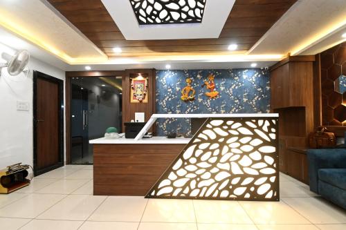 a room with a kitchen with a counter top and a counter top at Hotel Hallmark By THC Group in Kota