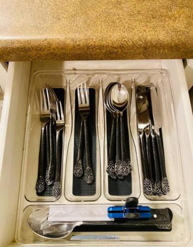a drawer filled with utensils in a kitchen at CHERRY ST LITTLE LOVE HOUSE* SHOP*DINE* RT 66*EXPO CENTER*BOK*DOWNTOWN in Tulsa