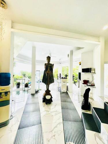 a statue of a woman in a room at Sunshine Ocean Sea View in Chaweng