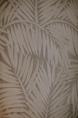 a close up of a palm tree leaf wallpaper at Prince Albert Lyon Bercy in Paris