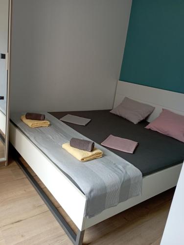a bed in a small room with towels on it at Guerilla Choice in Vodice