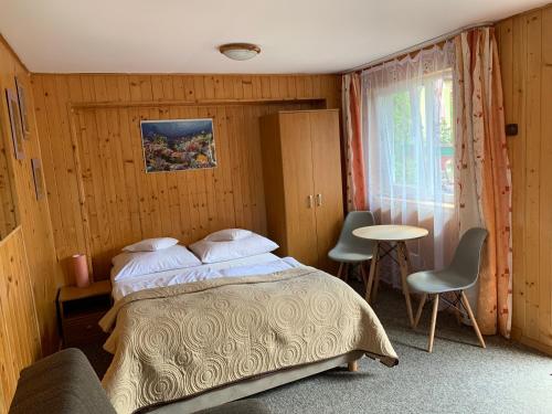 Llit o llits en una habitació de Willa Słoneczna