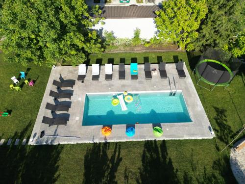 an overhead view of a swimming pool in a yard at Perryland Urban Farm in Piatra