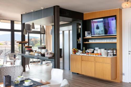 a kitchen with a counter with food on it at Hotel Alcyon in Porto-Vecchio