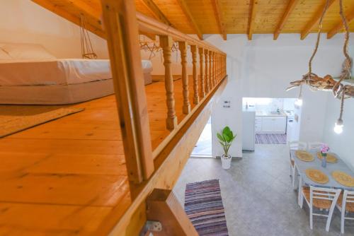 a large room with a table and a bed at Merabello Beach House in Samos