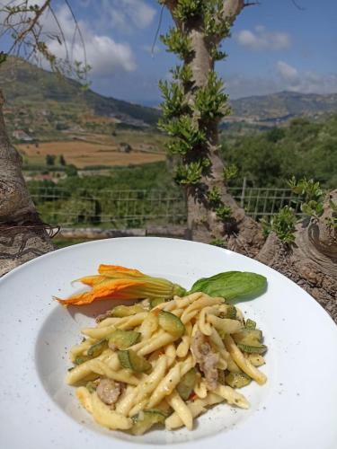 a plate of food with pasta on a table at Dimora dei Cardinali in Agropoli