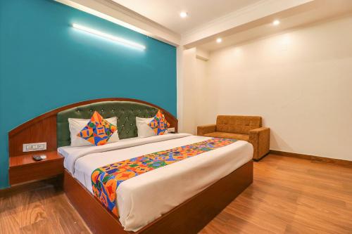 מיטה או מיטות בחדר ב-FabHotel Lime Tree