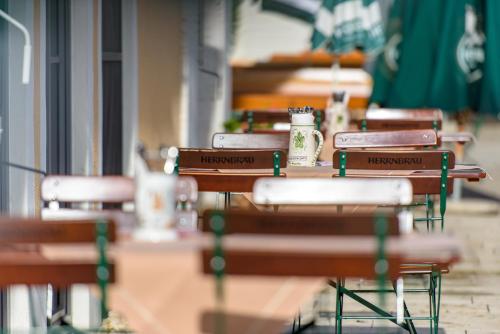 a row of tables and chairs in a classroom at Gasthaus Paulus in Neustadt an der Donau