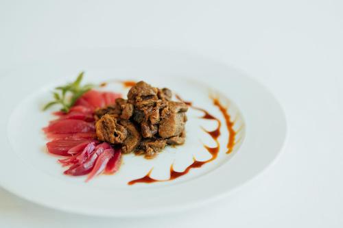 a plate of food on a white plate at Vallicciola Nature Hotel in Tempio Pausania