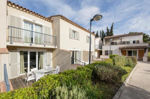 a house with a table and chairs in front of it at Garden & City Mont-Ventoux Malaucène in Malaucène