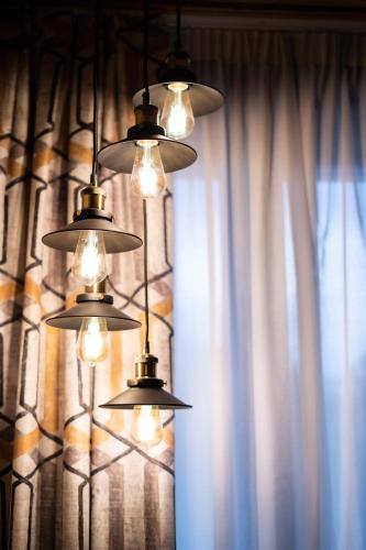 a group of lights hanging in front of a window at HOTEL SOMNIFABRIK in Valderrobres
