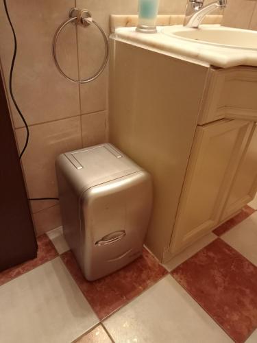 a bathroom with a toilet and a sink at Petit St George 100mt du lac a Montreux in Montreux