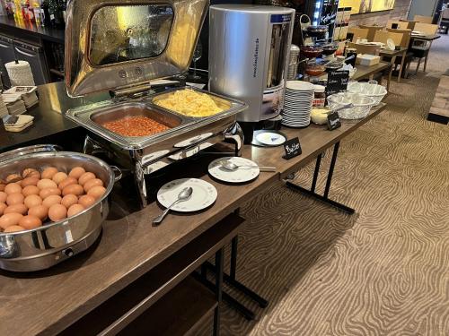 a buffet with eggs and other food on a table at Hotel Restaurant Ennen in Norderney