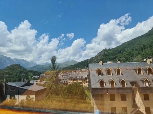 a view of a town with mountains in the background at Apartamento en Panticosa in Panticosa