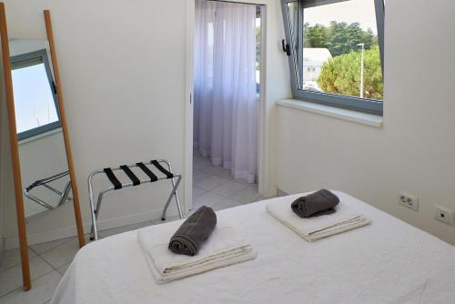 Postel nebo postele na pokoji v ubytování NOVIGRAD BOUTIQUE APARTMENT
