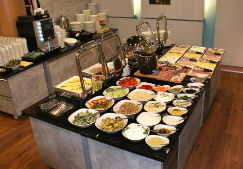 a buffet line with many different types of food at Hotel Felix in Warsaw