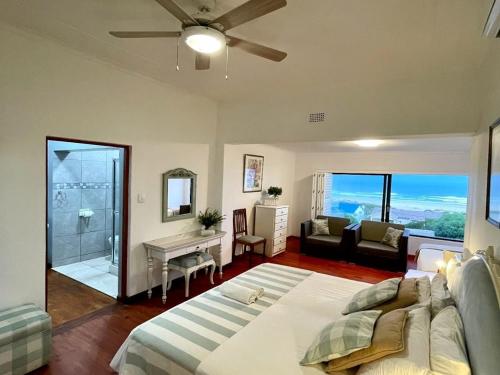 a bedroom with a bed and a living room at Oyster Bay Ten On Tornyn in Oyster Bay