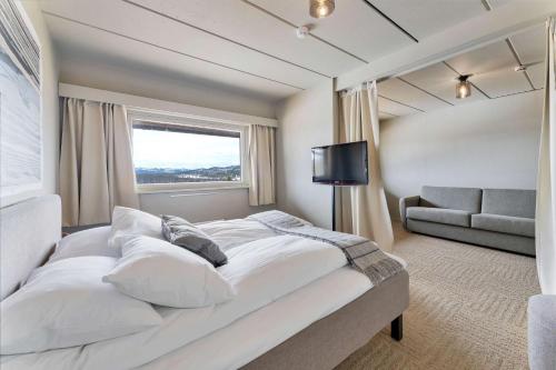 Ένα ή περισσότερα κρεβάτια σε δωμάτιο στο Ranten Hotell Best Western Signature Collection