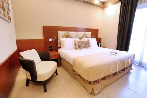 Ένα ή περισσότερα κρεβάτια σε δωμάτιο στο Hotel Agora Sure Hotel Collection by Best Western