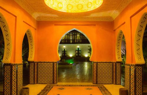 an entrance to a building with a chandelier at Palais Du Desert Hotel & Spa in Erfoud