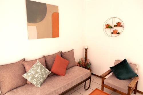 a living room with a couch and a chair at Klinkies in Potchefstroom