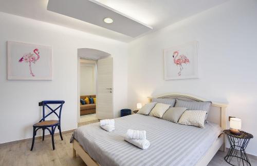 En eller flere senger på et rom på Apartments Vita