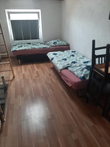 Ένα ή περισσότερα κρεβάτια σε δωμάτιο στο Hostel Airport