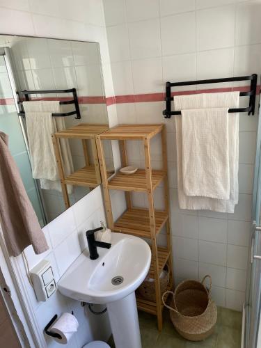 a bathroom with a sink and a mirror at Casa Tajo in Tarifa