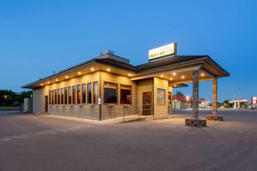 a building with a sign on top of it at Best Western King Salmon Inn in Soldotna