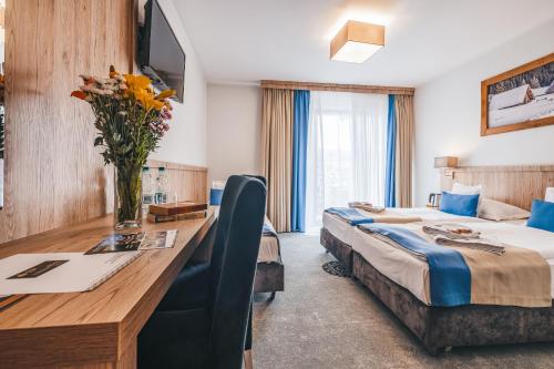 Grand Tatry - miejsce na wyjątkowy pobyt dla Ciebie i Twojej rodziny! - sauna i jacuzzi wliczone w cenę pobytu - 10 minut pieszo od Term Baniaにあるテレビまたはエンターテインメントセンター