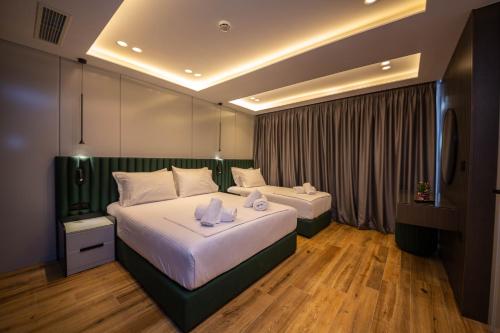 Un pat sau paturi într-o cameră la Hotel Lili-1