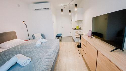 En eller flere senge i et værelse på Elisabeth Downtown Suites